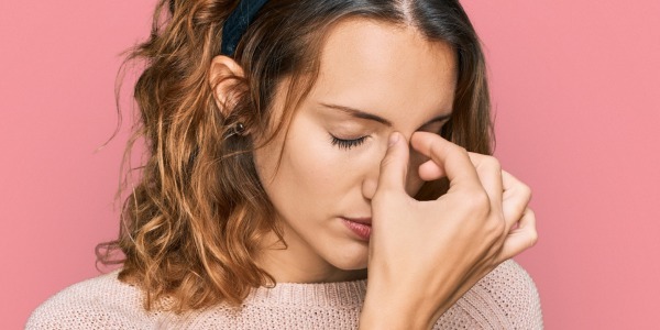young woman suffering from dry eye
