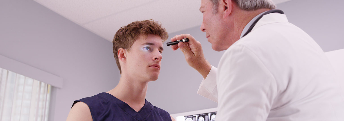 Young Athlete at Doctors office having eyes checked
